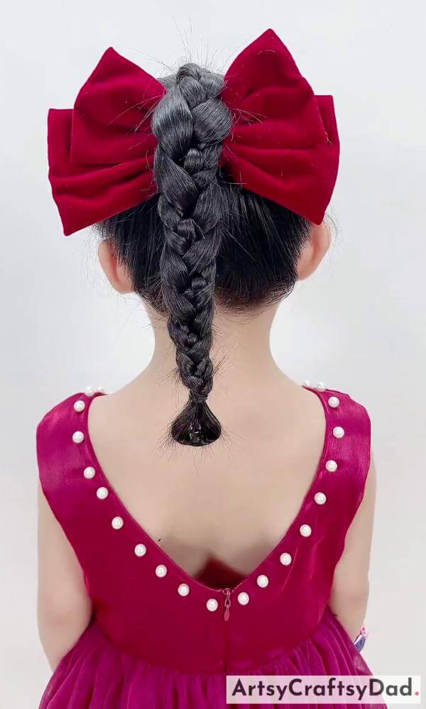 A Single Braided Ponytail With Bow Style - Charming Red Ribbon Braids Style for Kids