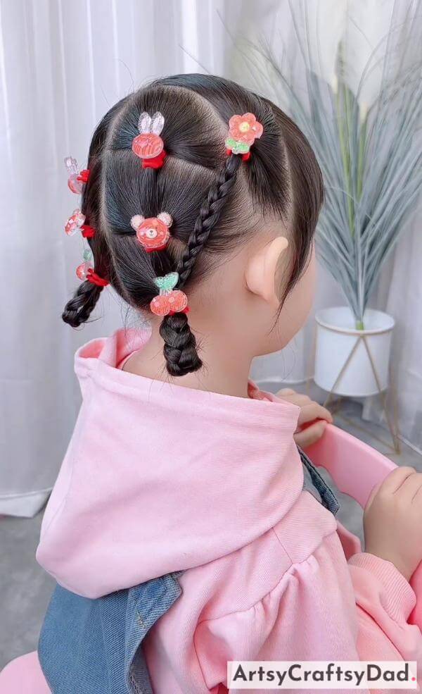 Cute Braided Hairstyle With Pink Clips-Cute braided hairstyle for youngsters