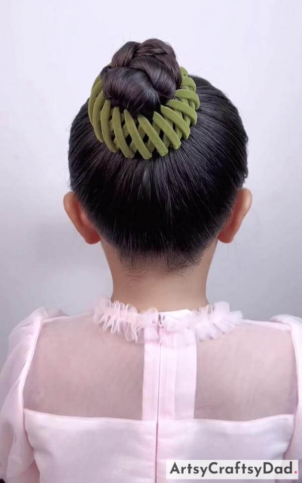 Easy Braided Bun Hairstyle With Rubber Band-Beautiful hairclips and a braided bun hairstyle for children.