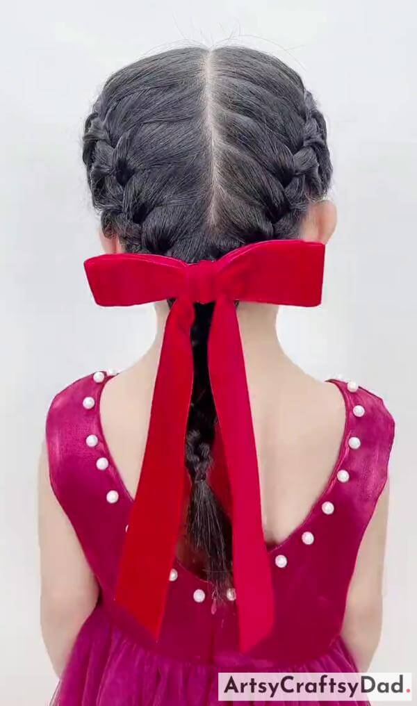 Lovely Fishtail Ponytail With Red Bow Ribbon-Child-friendly hairstyle featuring red ribbon braids