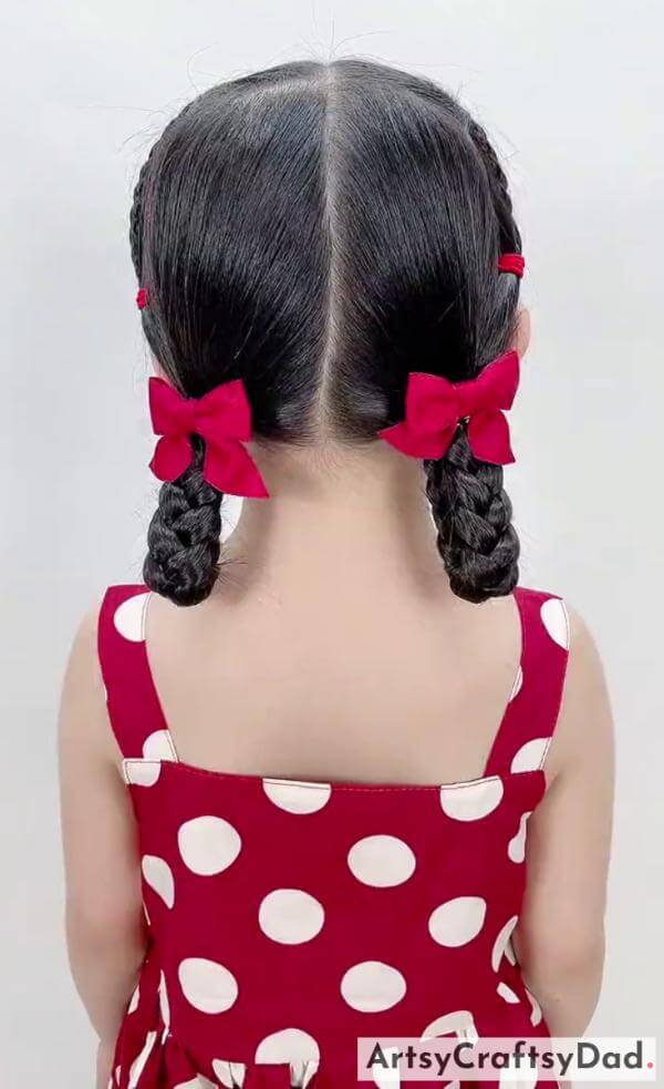 Simple Dual Fold Braids Hairstyle With Bow Clips-Cute and stylish hairstyle for kids with red ribbon braids