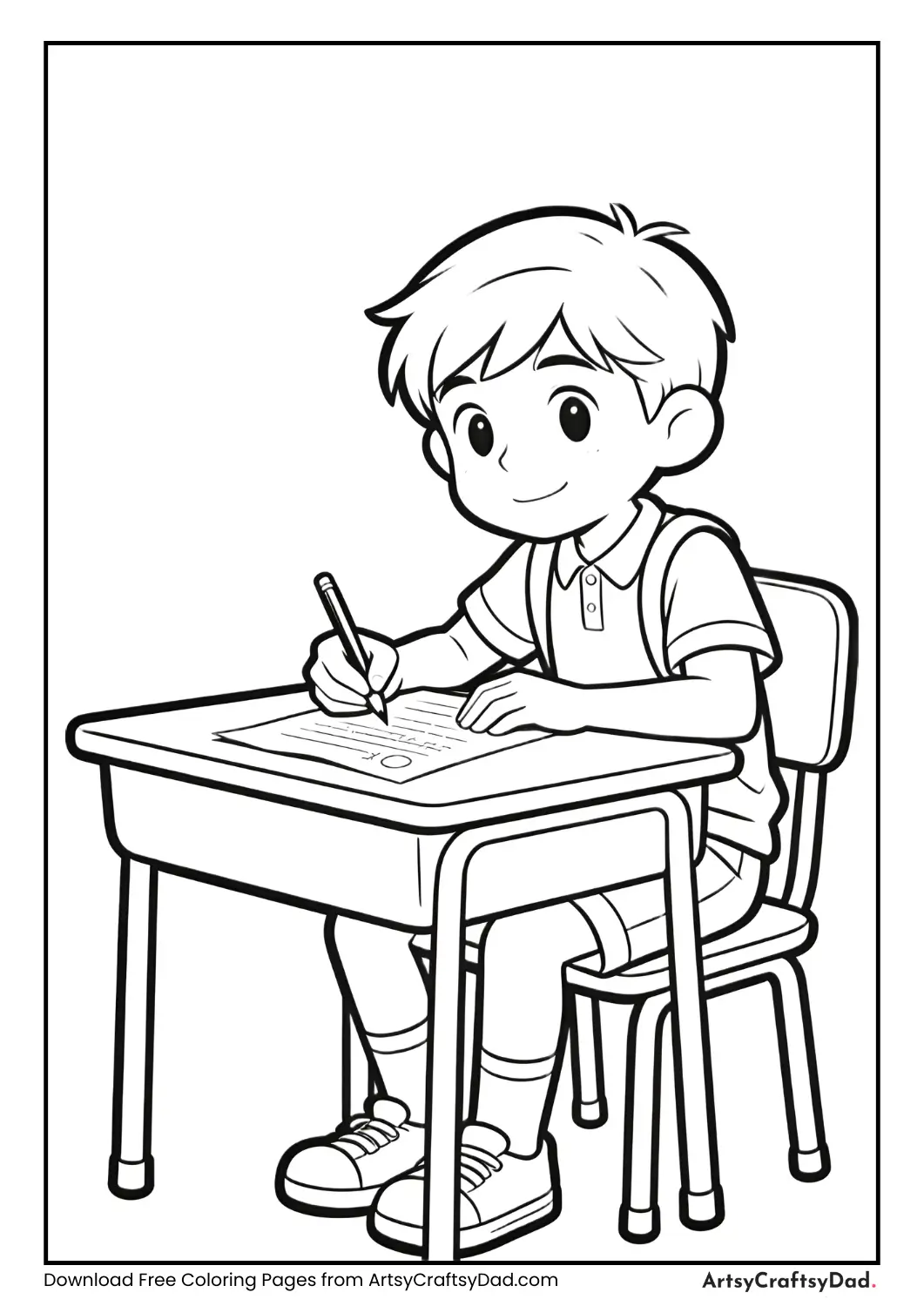 Student sitting at desk writing exam paper